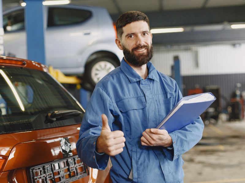 repair man with thumbs up