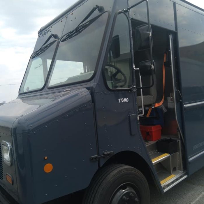 Commercial fleet vehicle requiring windshield replacement and auto glass repair services to maintain driver safety and business operations.